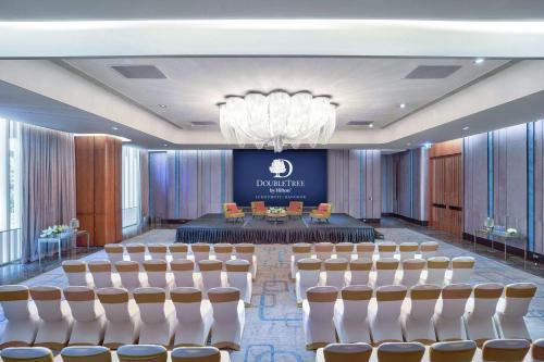 a conference room with chairs and a table in the middle at DoubleTree by Hilton Sukhumvit Bangkok in Bangkok