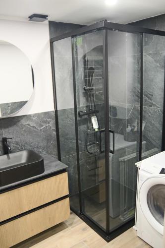 a bathroom with a shower with a sink and a toilet at Bilocale I cervi a pochi passi dalle piste con vista Mondolè in Prato Nevoso