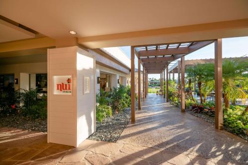 a hallway of a building with a sign on it at Hilton Waikoloa Village in Waikoloa