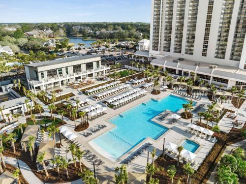 an aerial view of a resort with a pool at Embassy Suites by Hilton Myrtle Beach Oceanfront Resort in Myrtle Beach