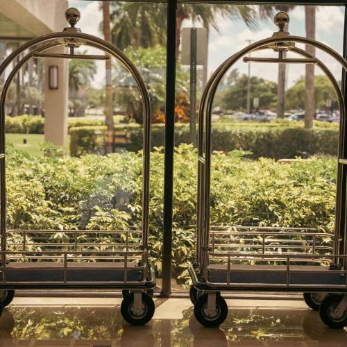 a pair of metal cages in front of a window at Hilton Palm Beach PBI in West Palm Beach