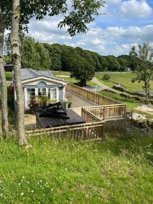 a house in the middle of a field at The Vogue Lodge in Buxton