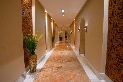 a hallway with a vase on the side of a building at DoubleTree by Hilton Resort & Spa Marjan Island in Ras al Khaimah