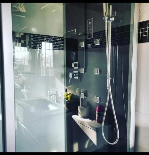 a bathroom with a shower and a sink at LUX CASITA Almendral in Lanjarón