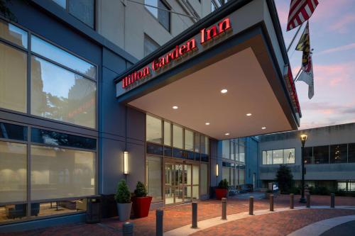 a building with a sign that reads union cancer inn at Hilton Garden Inn Bethesda Downtown in Bethesda