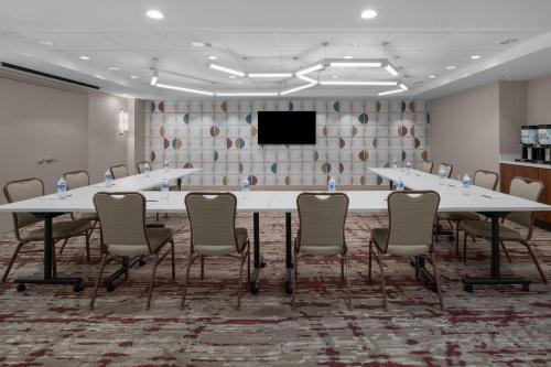 a conference room with a large table and chairs at Hilton Garden Inn Bethesda Downtown in Bethesda