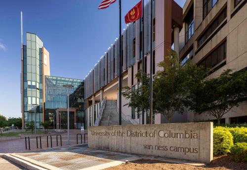 a university of the district of columbia sign in front of a building at Hilton Garden Inn Bethesda Downtown in Bethesda