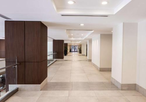 an empty hallway in a building with a hallway at Hilton Garden Inn Bethesda Downtown in Bethesda