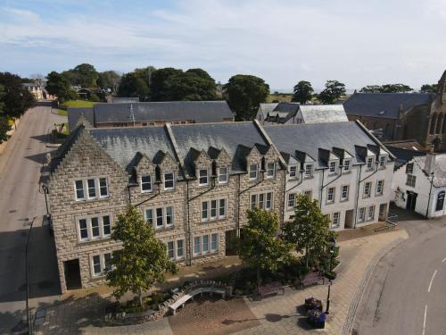 an overhead view of a large stone building with a street at 1 Argyle Place, Dornoch in Dornoch