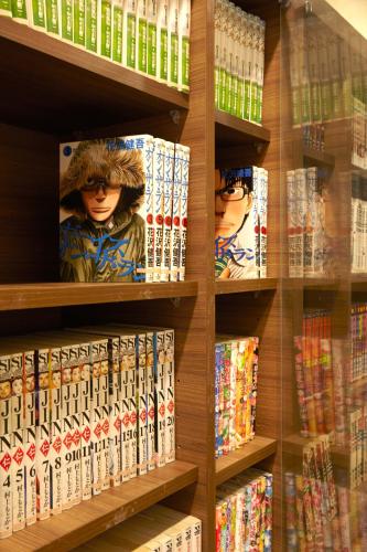 a store shelf filled with lots of video games at Axia South Cikarang Service Apartment in Cikarang