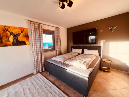 a bedroom with a bed in a room at New Chalet Platzhirsch Panorama Blick Sauna Rohrberg Maximilian in Rohrberg