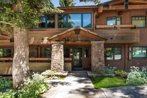 an image of a house with a wooden facade at Aspen Condo W Pool, Hot Tub & 2 Blocks To Gondola - Fh4 in Aspen