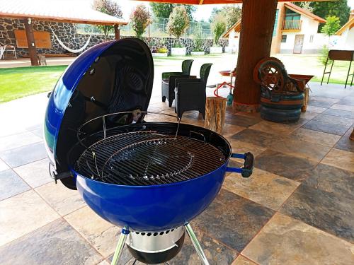 a blue grill sitting on top of a patio at Cabaña para pareja en huasca in Huasca de Ocampo