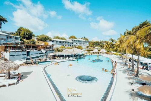 a pool at the black drupal resort at 913 Sweety Diamond View in Le Diamant