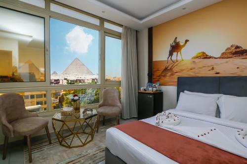 Postel nebo postele na pokoji v ubytování Pyramids Palace INN