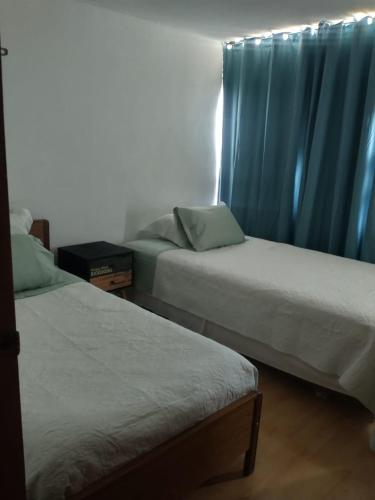 Lova arba lovos apgyvendinimo įstaigoje Hospedaje Kingui