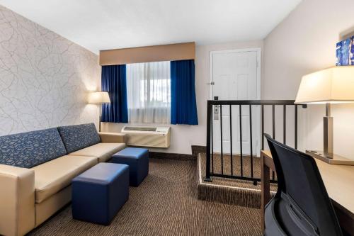 a living room with a couch and a table at Best Western Halton Hills in Georgetown