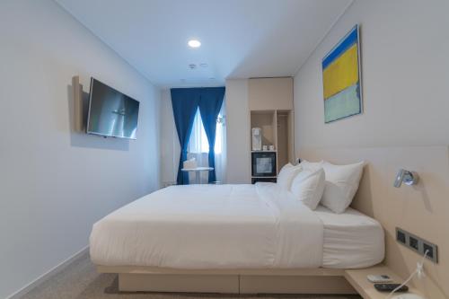 Cama o camas de una habitación en Hotel Myeongdongjang