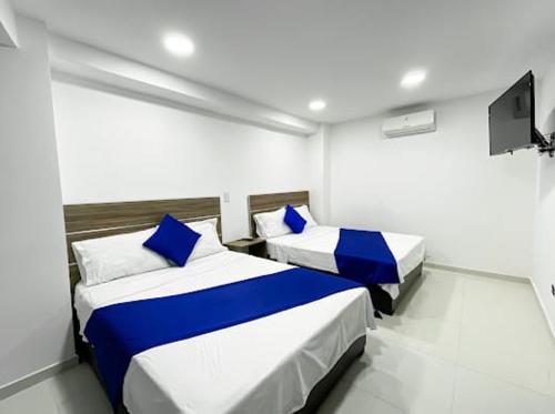 เตียงในห้องที่ Hotel Terraza
