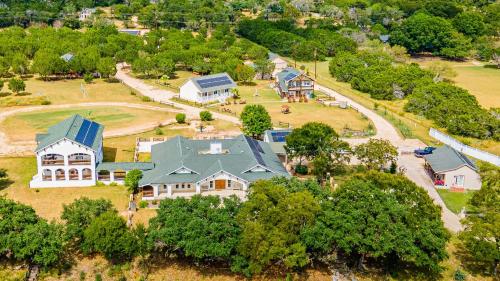 an aerial view of a large house with a yard at Casa Blanca in Texas Hill Country in Ingram