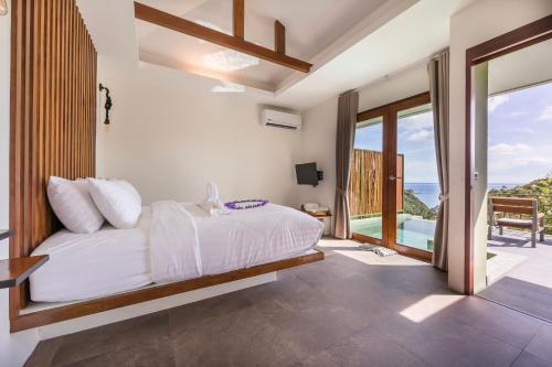 Postel nebo postele na pokoji v ubytování Mae Ya Resort