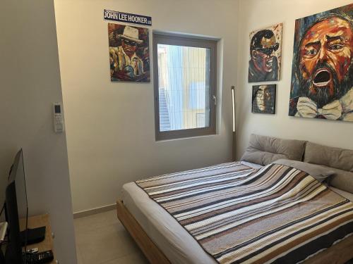 Postel nebo postele na pokoji v ubytování Marina Beach Rethymno
