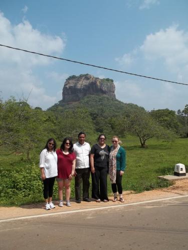a group of people standing in front of a mountain at Anura Home Stay in Kalutara