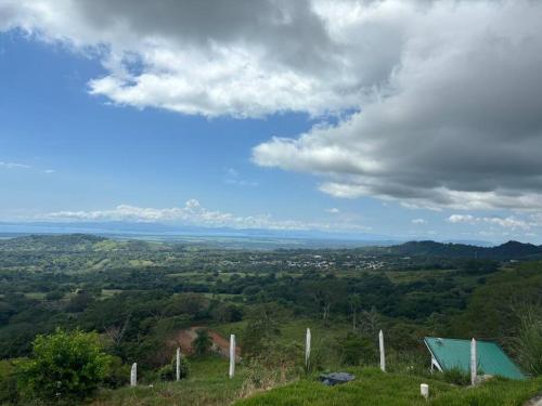 a view from the top of a hill at Cabaña con piscina y vista al mar in Puntarenas