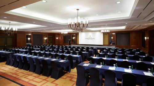 a conference room with chairs and a stage in the background at Grand InterContinental Seoul Parnas by IHG in Seoul