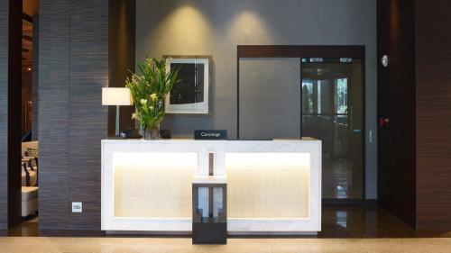 a lobby with a table with a plant on it at Grand InterContinental Seoul Parnas by IHG in Seoul