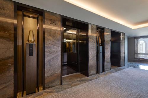 a row of elevators in a hotel lobby at Grand InterContinental Seoul Parnas by IHG in Seoul