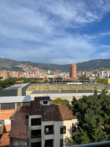 a view of a city with buildings and a parking lot at Ivanna Jumar ApartaHotel in Medellín