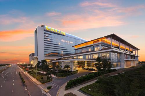 a building with a sign on the side of it at Solaire Resort Entertainment City in Manila
