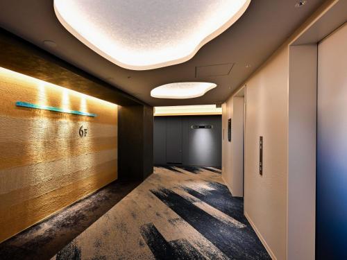 an office corridor with a large ceiling at Kobe Suma Seaworld Hotel in Kobe