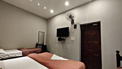 Ένα ή περισσότερα κρεβάτια σε δωμάτιο στο Ecovilla luxury 5s