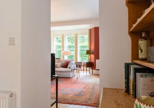 a living room with a couch and a television at Gorgeous 3BD in Oxfordshire - Stunning Countryside! in Steeple Aston