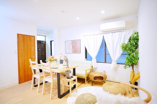 a dining room with a table and chairs at Bohemian Tokyo in Tokyo