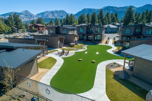 an aerial view of a yard with houses and mountains at Outbound Mammoth in Mammoth Lakes