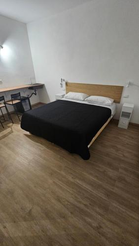 a bedroom with a large bed in a room at La Venére 5Terre in La Spezia