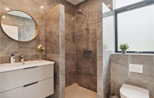 a bathroom with a shower and a sink at 6 Bedroom Nice Home In Glesborg in Glesborg