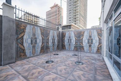 a balcony with a mural on the side of a building at Clarion Hotel Istanbul Mahmutbey in Istanbul