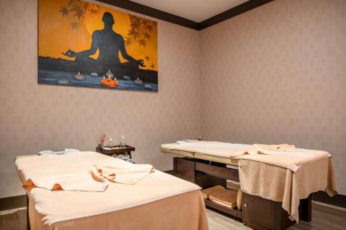 a therapy room with two beds and a painting at Clarion Hotel Istanbul Mahmutbey in Istanbul