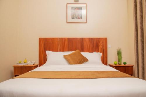 Postel nebo postele na pokoji v ubytování Flamarc Hotel