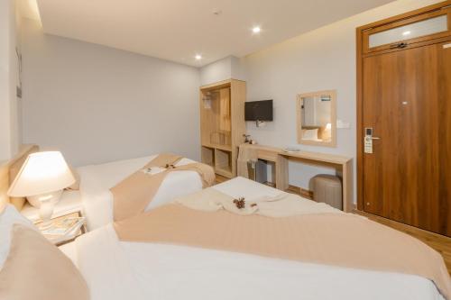 TV a/nebo společenská místnost v ubytování Gia Nguyễn Hotel Dalat