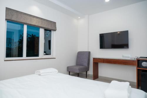 Televisyen dan/atau pusat hiburan di Gold Inn Exotica