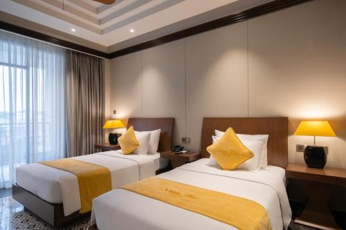 Senna Hue Hotelにあるベッド
