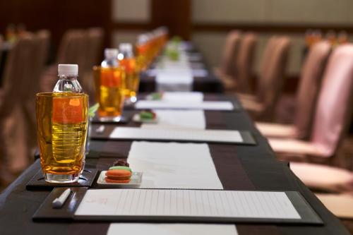 a long table with glasses of drinks on it at Solaire Resort Entertainment City in Manila