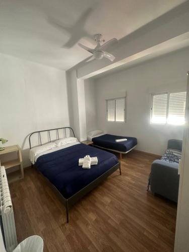 Ένα ή περισσότερα κρεβάτια σε δωμάτιο στο Rooms Valencia Center
