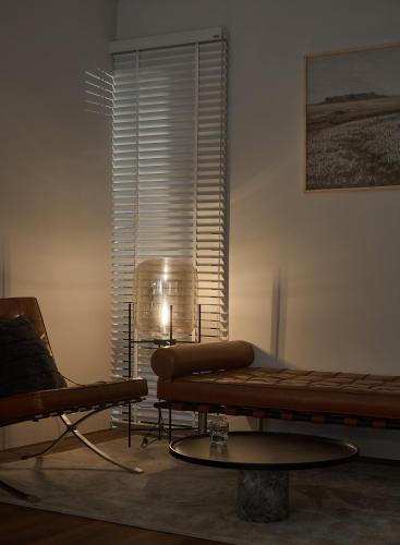 a living room with a couch and a table at The Hota House in Hanoi