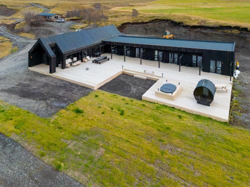 an overhead view of a house with a deck at Stuðlastrengur - Luxury private villa in Selfoss